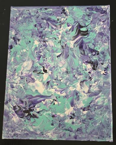 Picture of Balloon Art in purple, whites, and aqua blue.