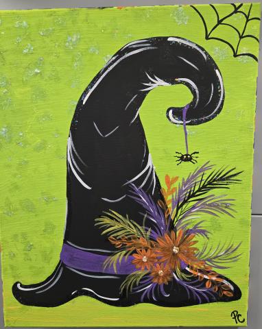 Picture of a witches black hat with flowers on the front