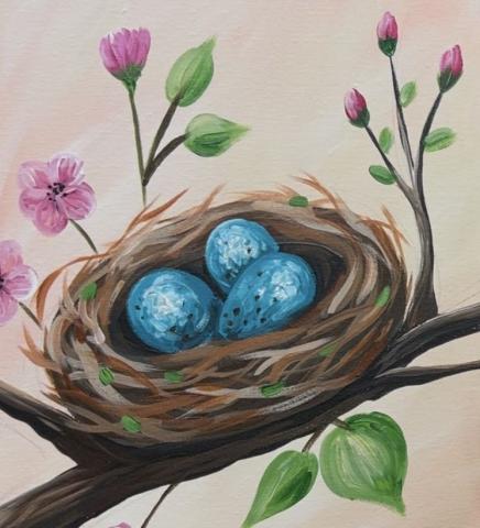 Birds nest with blue eggs inside