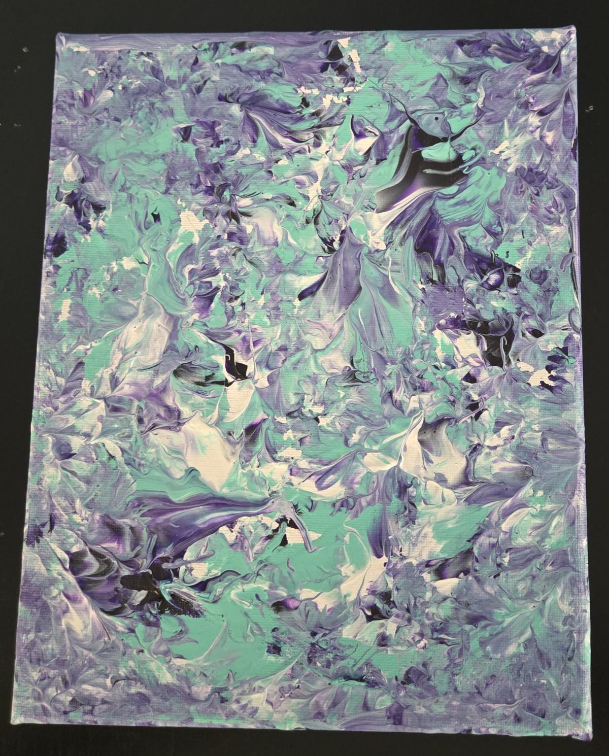 Picture of Balloon Art in purple, whites, and aqua blue.